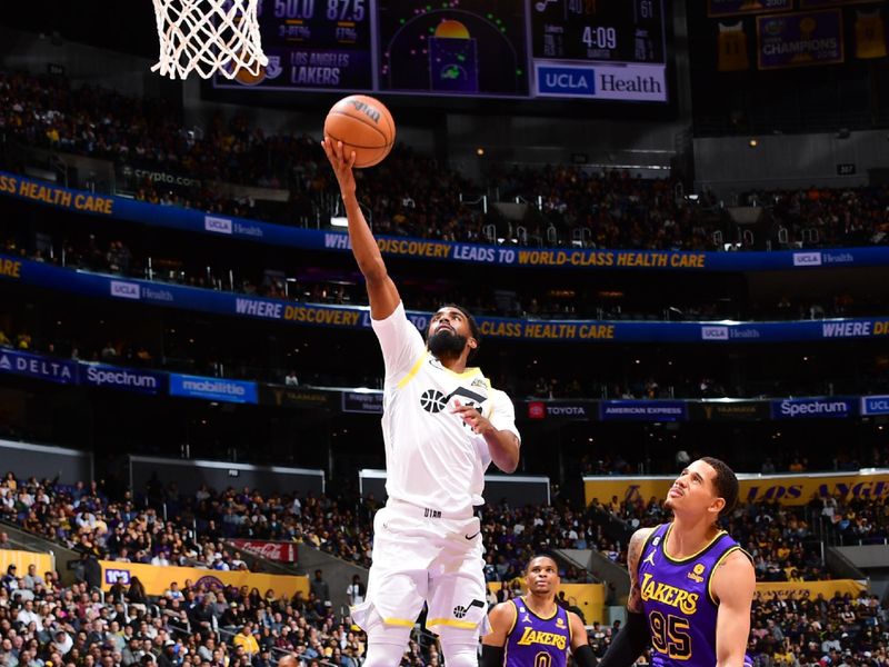 LOS ANGELES, CA - NOVEMBER 4: Mike Conley #11 of the Utah Jazz drives to the basket during the game against the Los Angeles Lakers on November 4, 2022 at Crypto.Com Arena in Los Angeles, California. NOTE TO USER: User expressly acknowledges and agrees that, by downloading and/or using this Photograph, user is consenting to the terms and conditions of the Getty Images License Agreement. Mandatory Copyright Notice: Copyright 2022 NBAE (Photo by Adam Pantozzi/NBAE via Getty Images)