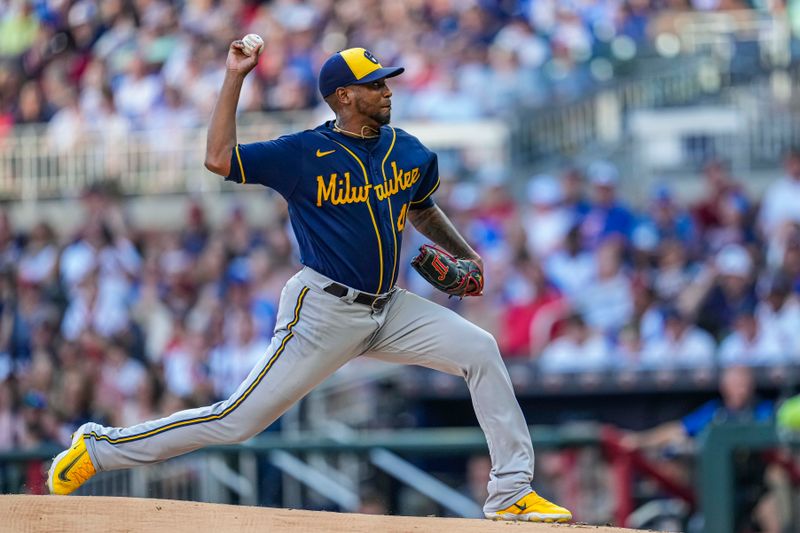 Jul 29, 2023; Cumberland, Georgia, USA; Milwaukee Brewers starting pitcher Julio Teheran (49) pitches against the Atlanta Braves during the first inning at Truist Park. Mandatory Credit: Dale Zanine-USA TODAY Sports