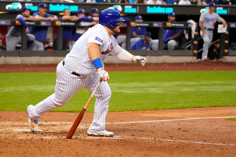 Jul 16, 2023; New York City, New York, USA; New York Mets designated hitter Daniel Vogelbach (32) hits a single against the Los Angeles Dodgers during the ninth inning at Citi Field. Mandatory Credit: Gregory Fisher-USA TODAY Sports