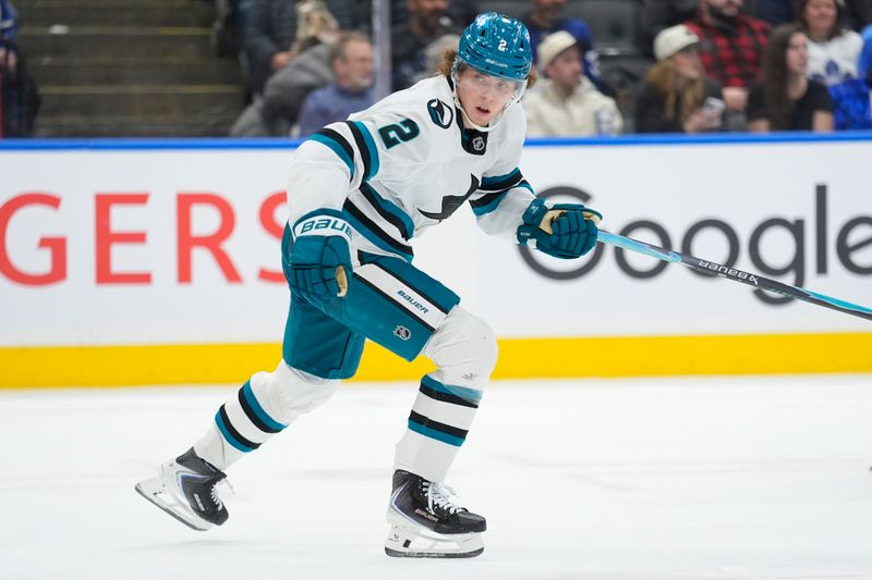 Dec 11, 2025; Toronto, Ontario, CAN; San Jose Sharks forward Will Smith (2) heads up ice against the Toronto Maple Leafs during overtime at Scotiabank Arena. Mandatory Credit: John E. Sokolowski-Imagn Images