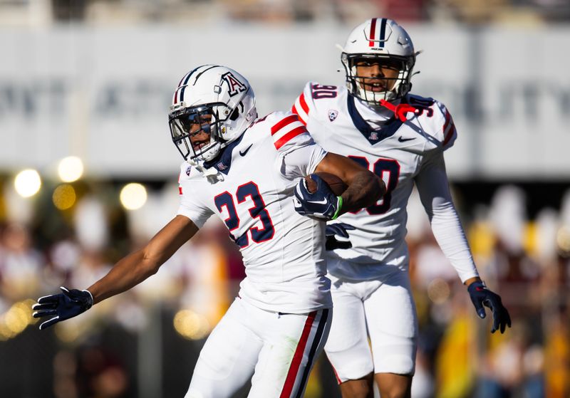 Nov 25, 2023; Tempe, Arizona, USA; Arizona Wildcats cornerback Tacario Davis (23) returns a fumble against the Arizona State Sun Devils in the first half of the Territorial Cup at Mountain America Stadium. Mandatory Credit: Mark J. Rebilas-USA TODAY Sports