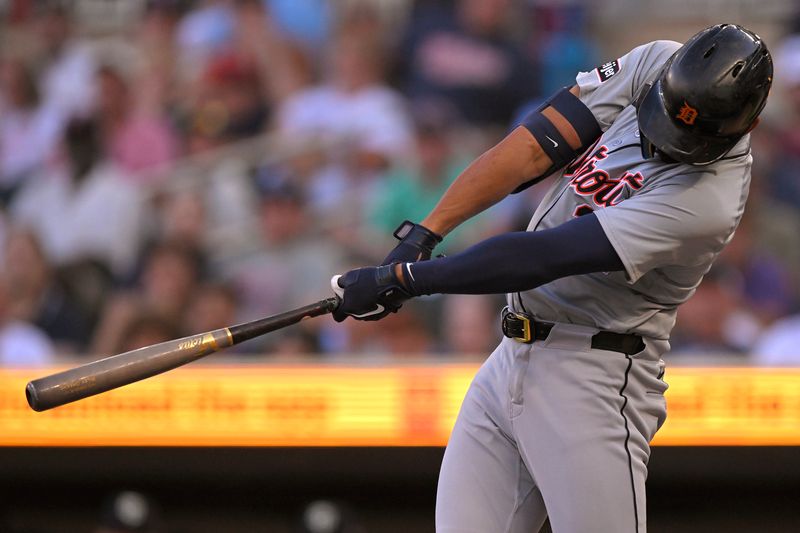 Jul 3, 2024; Minneapolis, Minnesota, USA; Detroit Tigers outfielder Riley Greene (31) hits a triple against the Minnesota Twins during the first inning at Target Field. Mandatory Credit: Nick Wosika-USA TODAY Sports