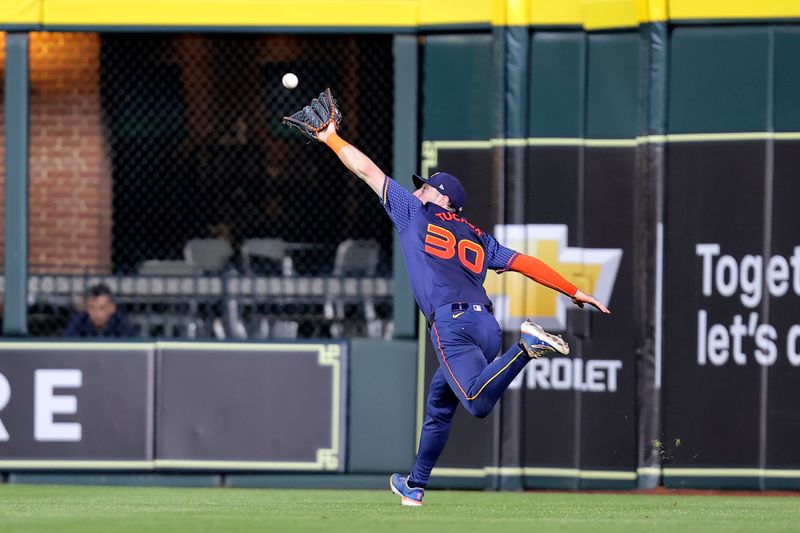 May 20, 2024; Houston, Texas, USA; Houston Astros right fielder Kyle Tucker (30) catches a line drive for an out against the Los Angeles Angels during the sixth inning at Minute Maid Park. Mandatory Credit: Erik Williams-USA TODAY Sports