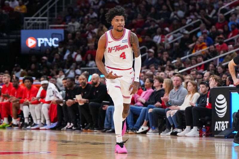 HOUSTON, TEXAS - DECEMBER 27: Jalen Green #4 of the Houston Rockets reacts after sinking a three point shot in the second half of the game against the Phoenix Suns at Toyota Center on December 27, 2023 in Houston, Texas. User expressly acknowledges and agrees that, by downloading and or using this photograph, User is consenting to the terms and conditions of the Getty Images License Agreement. (Photo by Alex Bierens de Haan/Getty Images)