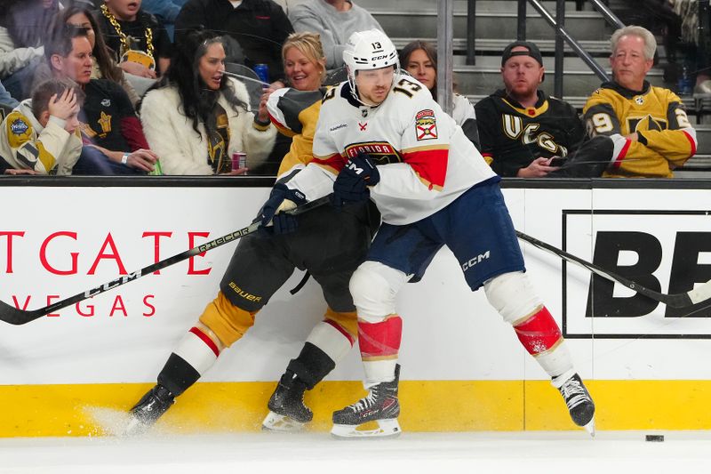 Jan 4, 2024; Las Vegas, Nevada, USA; Florida Panthers center Sam Reinhart (13) checks Vegas Golden Knights defenseman Zach Whitecloud (2) during the third period at T-Mobile Arena. Mandatory Credit: Stephen R. Sylvanie-USA TODAY Sports