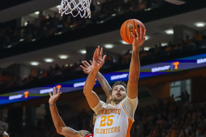 Jan 6, 2024; Knoxville, Tennessee, USA; Tennessee Volunteers guard Santiago Vescovi (25) goes to the basket against the Mississippi Rebels during the first half at Thompson-Boling Arena at Food City Center. Mandatory Credit: Randy Sartin-USA TODAY Sports