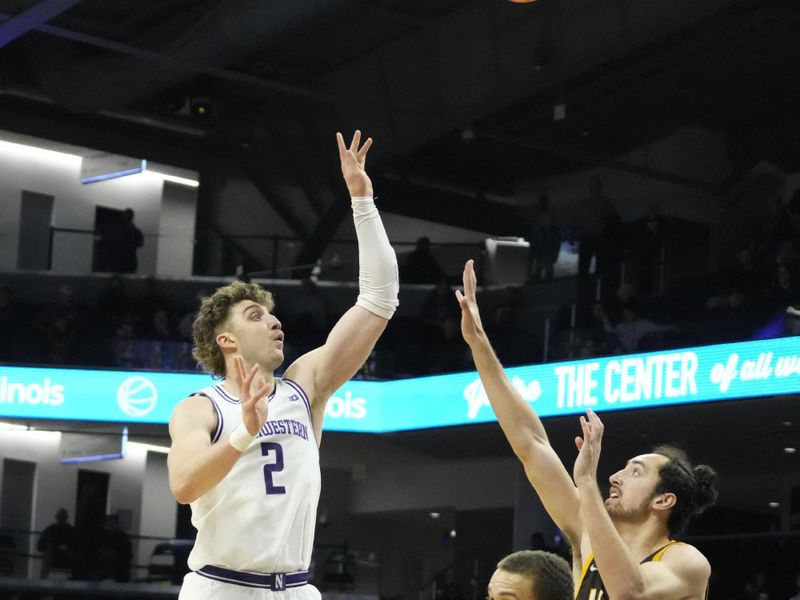 Dec 16, 2025; Evanston, Illinois, USA; Northwestern Wildcats forward Nick Martinelli (2) shoots over Valparaiso Beacons forward Carter Hopoi (13) during the first half at Welsh-Ryan Arena. Mandatory Credit: David Banks-Imagn Images