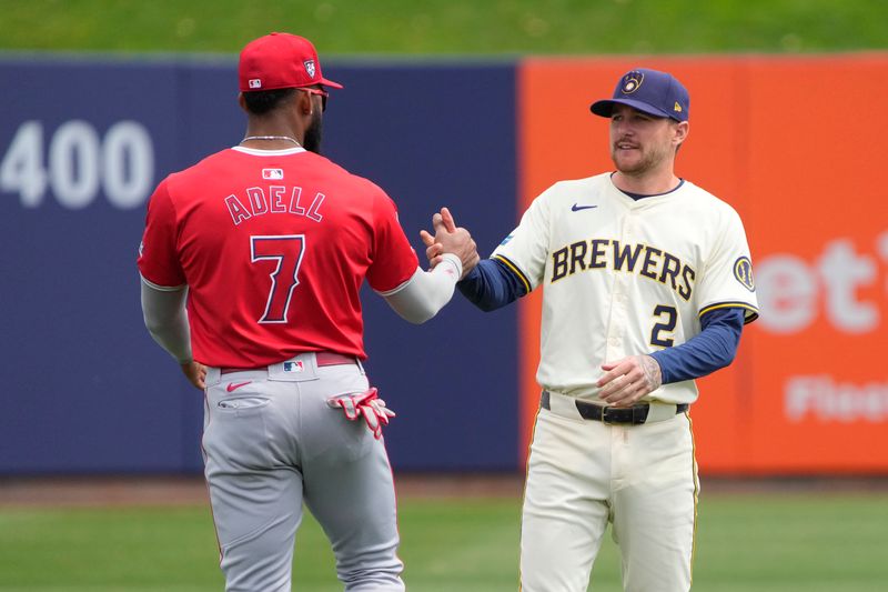 Mar 18, 2024; Phoenix, Arizona, USA; Los Angeles Angels right fielder Jo Adell (7) and Milwaukee Brewers second baseman Brice Turang (2) talk before a game at American Family Fields of Phoenix. Mandatory Credit: Rick Scuteri-USA TODAY Sports