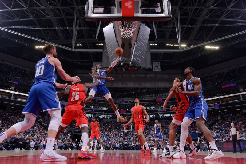 SACRAMENTO, CA - APRIL 14:  Keon Ellis #23 of the Sacramento Kings goes to the basket during the game on April 14, 2024 at Golden 1 Center in Sacramento, California. NOTE TO USER: User expressly acknowledges and agrees that, by downloading and or using this Photograph, user is consenting to the terms and conditions of the Getty Images License Agreement. Mandatory Copyright Notice: Copyright 2024 NBAE (Photo by Rocky Widner/NBAE via Getty Images)