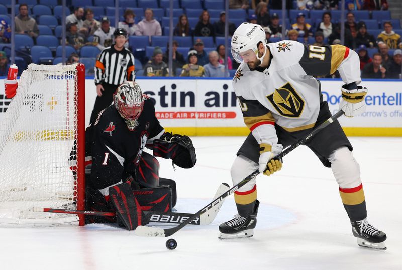 Mar 2, 2024; Buffalo, New York, USA;  Buffalo Sabres goaltender Ukko-Pekka Luukkonen (1) watches as Vegas Golden Knights center Nicolas Roy (10) looks to control the puck during the third period at KeyBank Center. Mandatory Credit: Timothy T. Ludwig-USA TODAY Sports