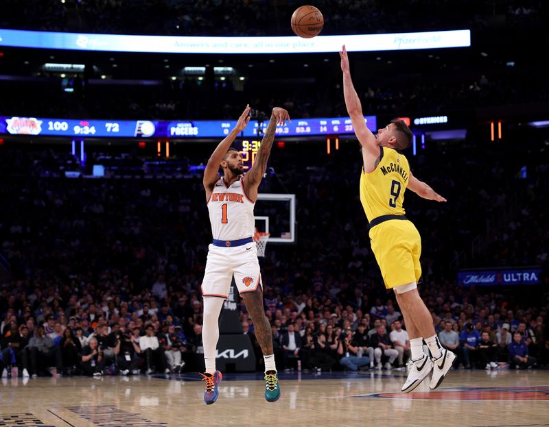 NEW YORK, NEW YORK - OCTOBER 25: Cameron Payne #1 of the New York Knicks takes a shot as T.J. McConnell #9 of the Indiana Pacers defends at Madison Square Garden on October 25, 2024 in New York City. NOTE TO USER: User expressly acknowledges and agrees that, by downloading and or using this photograph, User is consenting to the terms and conditions of the Getty Images License Agreement. (Photo by Elsa/Getty Images)