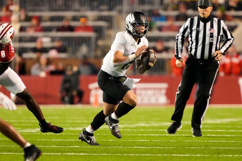 Nov 16, 2024; Madison, Wisconsin, USA;  Oregon Ducks quarterback Dillon Gabriel (8) looks to throw a pass during the first quarter against the Wisconsin Badgers at Camp Randall Stadium. Mandatory Credit: Jeff Hanisch-Imagn Images