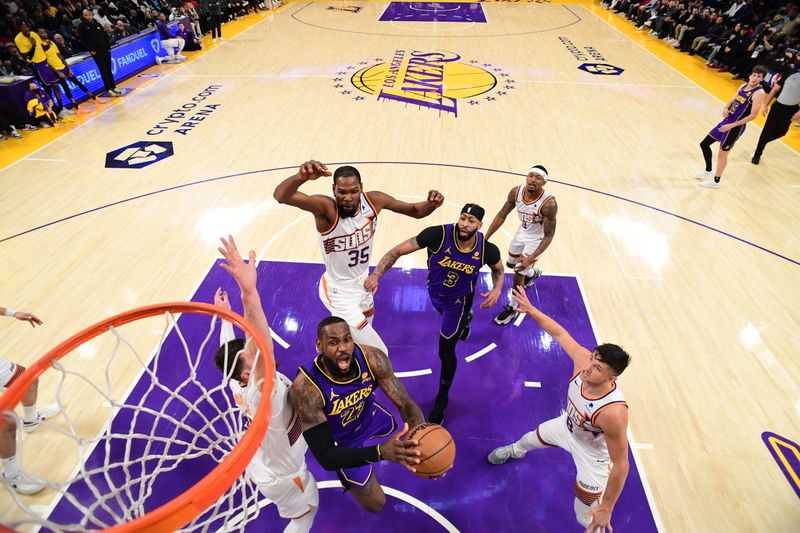 LOS ANGELES, CA - JANUARY 11: LeBron James #23 of the Los Angeles Lakers drives to the basket during the game against the Phoenix Suns on January 11, 2024 at Crypto.Com Arena in Los Angeles, California. NOTE TO USER: User expressly acknowledges and agrees that, by downloading and/or using this Photograph, user is consenting to the terms and conditions of the Getty Images License Agreement. Mandatory Copyright Notice: Copyright 2024 NBAE (Photo by Adam Pantozzi/NBAE via Getty Images)