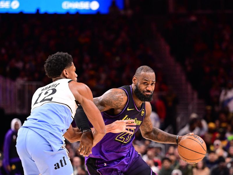 ATLANTA, GA - DECEMBER 6: LeBron James #23 of the Los Angeles Lakers handles the ball during the game against the Atlanta Hawks on December 6, 2024 at State Farm Arena in Atlanta, Georgia.  NOTE TO USER: User expressly acknowledges and agrees that, by downloading and/or using this Photograph, user is consenting to the terms and conditions of the Getty Images License Agreement. Mandatory Copyright Notice: Copyright 2024 NBAE (Photo by Adam Hagy/NBAE via Getty Images)