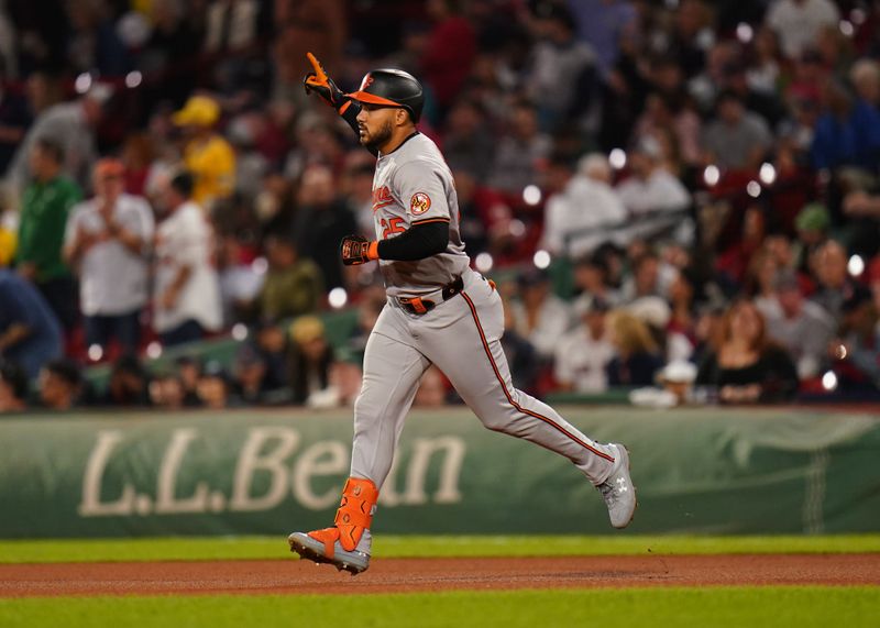 Sep 11, 2024; Boston, Massachusetts, USA; Baltimore Orioles designated hitter Anthony Santander (25) hits a home run against the Boston Red Sox in the eighth inning at Fenway Park. Mandatory Credit: David Butler II-Imagn Images