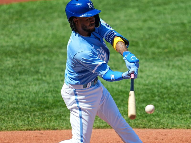 Sep 3, 2023; Kansas City, Missouri, USA; Kansas City Royals third baseman Maikel Garcia (11) hits a single during the third inning against the Boston Red Sox at Kauffman Stadium. Mandatory Credit: Jay Biggerstaff-USA TODAY Sports