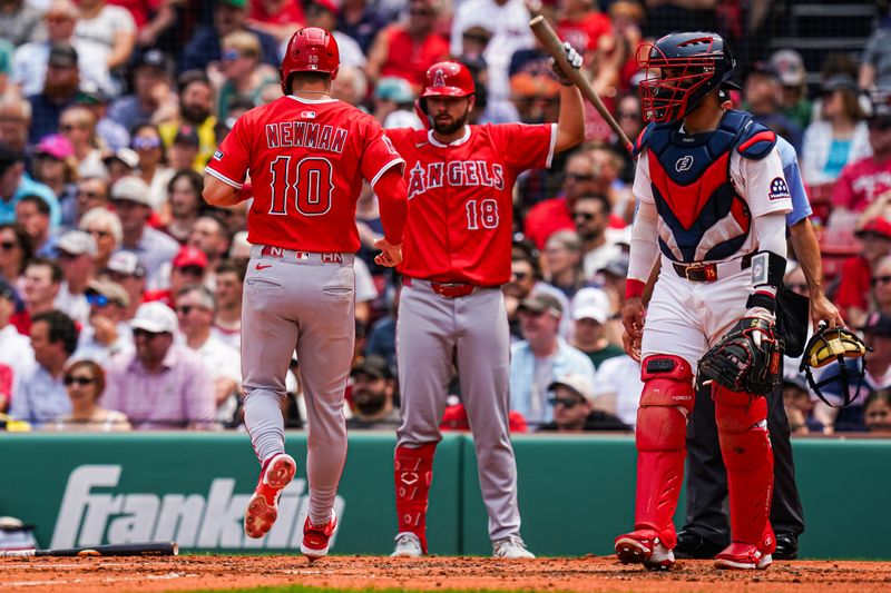 Jun 4, 2025; Boston, Massachusetts, USA; Los Angeles Angels third base Kevin Newman (10) scores against the Boston Red Sox in the second inning at Fenway Park. Mandatory Credit: David Butler II-Imagn Images