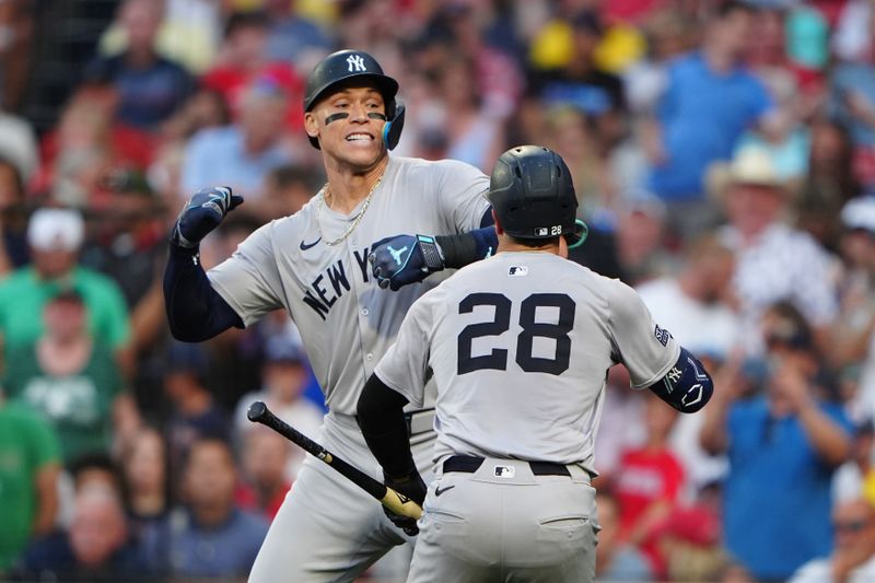 Jul 27, 2024; Boston, Massachusetts, USA; New York Yankees catcher Austin Wells (28) congratulates New York Yankees designated hitter Aaron Judge (99) for hitting a home run during the first inning at Fenway Park. Mandatory Credit: Gregory Fisher-USA TODAY Sports