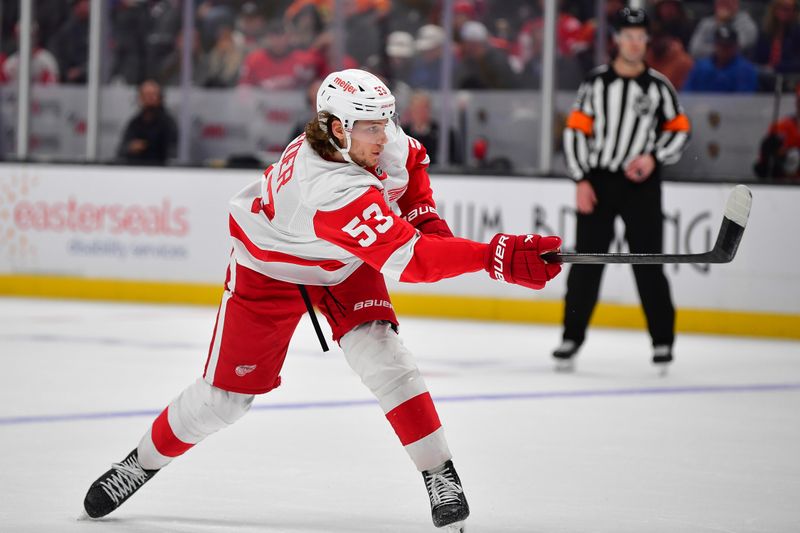 Nov 15, 2024; Anaheim, California, USA; Detroit Red Wings defenseman Moritz Seider (53) shoots on goal against the Anaheim Ducks  during the third period at Honda Center. Mandatory Credit: Gary A. Vasquez-Imagn Images