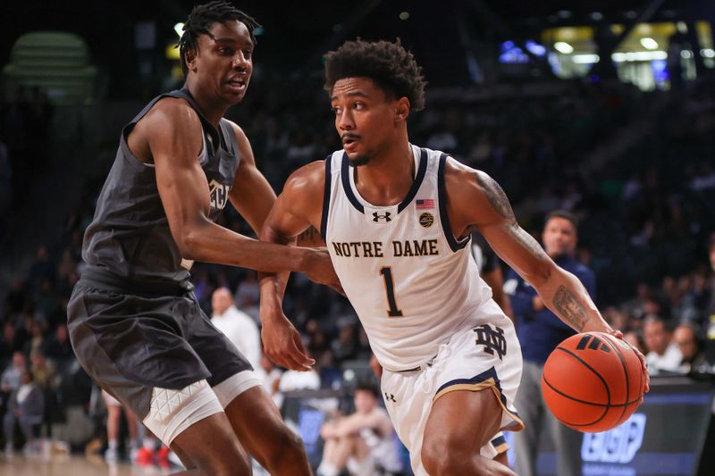 Jan 9, 2024; Atlanta, Georgia, USA; Notre Dame Fighting Irish guard Julian Roper II (1) drives on Georgia Tech Yellow Jackets forward Tafara Gapare (5) in the first half at McCamish Pavilion. Mandatory Credit: Brett Davis-USA TODAY Sports