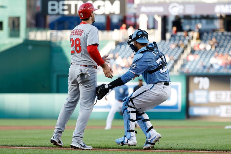 May 9, 2025; Washington, District of Columbia, USA; St. Louis Cardinals third base Nolan Arenado (28) is tagged out by Washington Nationals catcher Keibert Ruiz (20) after being caught in a rundown during the first inning at Nationals Park. Mandatory Credit: Geoff Burke-Imagn Images