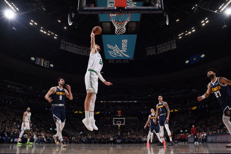 DENVER, CO - JANUARY 7: Kristaps Porzingis #8 of the Boston Celtics drives to the basket during the game against the Denver Nuggets on January 7, 2025 at Ball Arena in Denver, Colorado. NOTE TO USER: User expressly acknowledges and agrees that, by downloading and/or using this Photograph, user is consenting to the terms and conditions of the Getty Images License Agreement. Mandatory Copyright Notice: Copyright 2025 NBAE (Photo by Garrett Ellwood/NBAE via Getty Images)