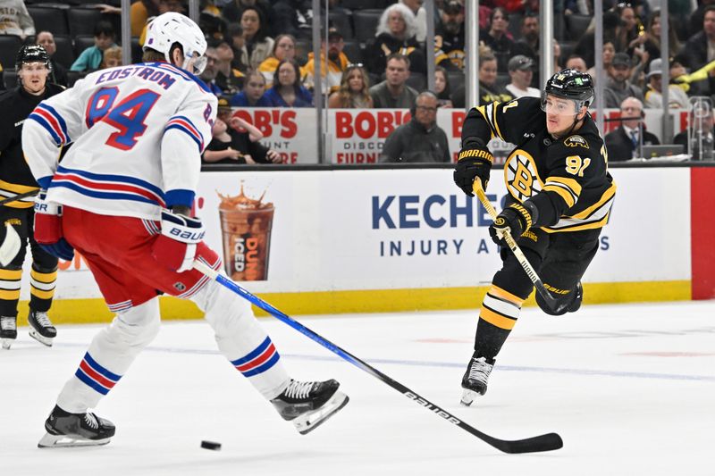 Oct 4, 2025; Boston, Massachusetts, USA; Boston Bruins defenseman Nikita Zadorov (91) shoots at the net during the first period against the New York Rangers at TD Garden. Mandatory Credit: Eric Canha-Imagn Images