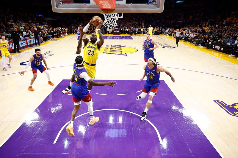 LOS ANGELES, CALIFORNIA - APRIL 25:  LeBron James #23 of the Los Angeles Lakers takes a shot against Kentavious Caldwell-Pope #5 of the Denver Nuggets in the first quarter during game three of the Western Conference First Round Playoffs at Crypto.com Arena on April 25, 2024 in Los Angeles, California.  (Photo by Ronald Martinez/Getty Images)