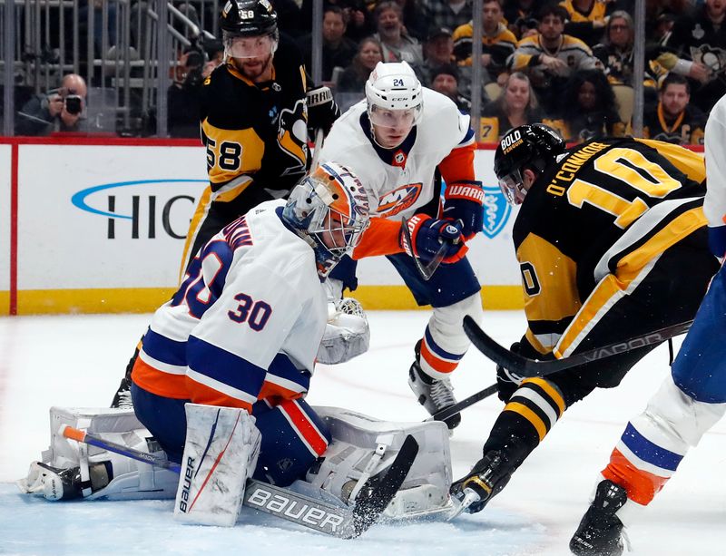 Feb 20, 2024; Pittsburgh, Pennsylvania, USA; New York Islanders goaltender Ilya Sorokin (30) defends the net against Pittsburgh Penguins left wing Drew O'Connor (10) during the third period at PPG Paints Arena. New York won 5-4 in overtime.Mandatory Credit: Charles LeClaire-USA TODAY Sports