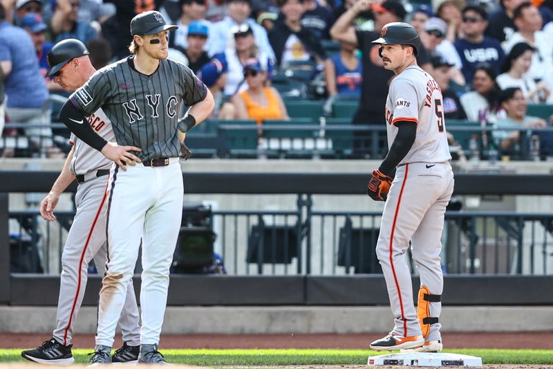 May 25, 2024; New York City, New York, USA;  New York Mets third baseman Brett Baty (22) looks at the scoreboard after San Francisco Giants right fielder Mike Yastrzemski (5) stops on third base after hitting a three run triple in the tenth inning at Citi Field. Mandatory Credit: Wendell Cruz-USA TODAY Sports