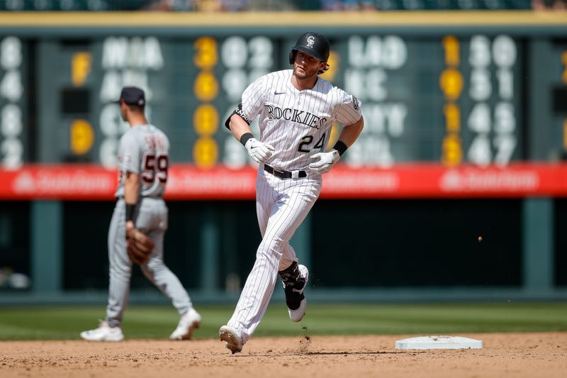 Jul 2, 2023; Denver, Colorado, USA; Colorado Rockies third baseman Ryan McMahon (24) rounds the bases on a two run home in the eighth inning against the Detroit Tigers at Coors Field. Mandatory Credit: Isaiah J. Downing-USA TODAY Sports