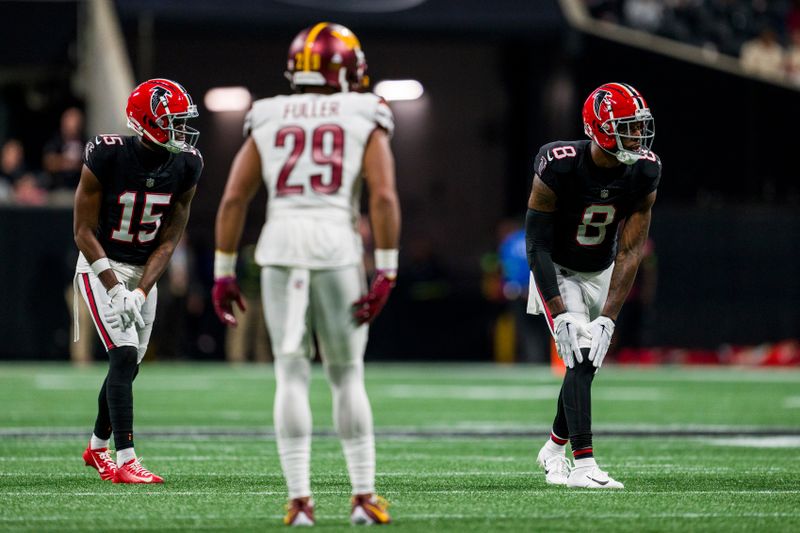 Atlanta Falcons wide receiver Van Jefferson (15) and tight end Kyle Pitts (8) line up during the second half of an NFL football game against the Washington Commanders, Sunday, Oct. 15, 2023, in Atlanta. The Washington Commanders won 24-16. (AP Photo/Danny Karnik)