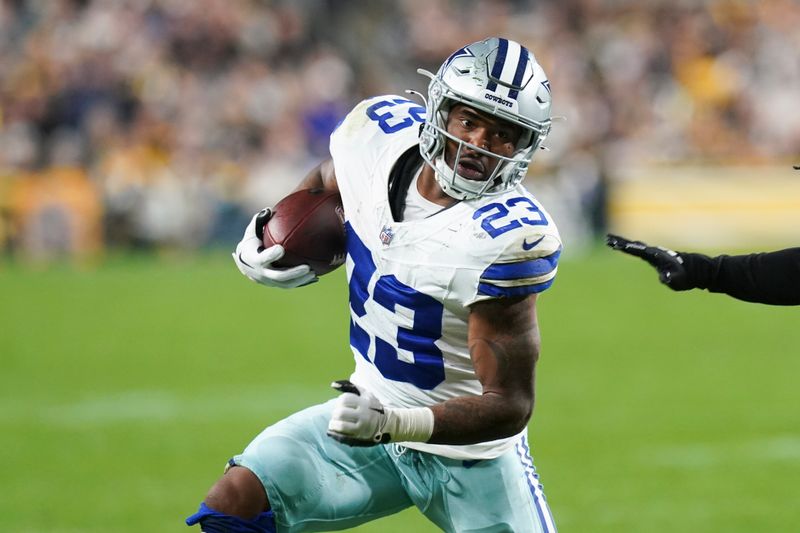 Dallas Cowboys running back Rico Dowdle runs with the gall against the Pittsburgh Steelers during the first half of an NFL football game, Sunday, Oct. 6, 2024, in Pittsburgh. (AP Photo/Matt Freed)