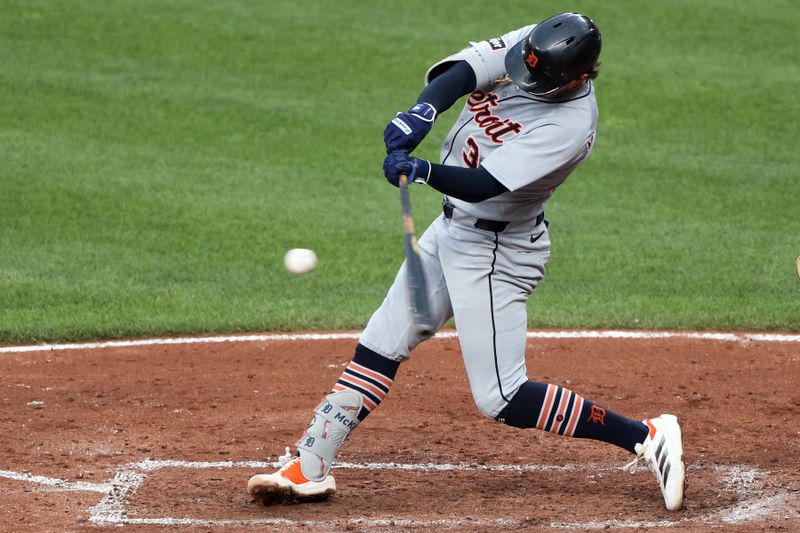 Jun 10, 2025; Baltimore, Maryland, USA; Detroit Tigers outfielder Zach McKinstry (39) hits a triple during the fifth inning against the Baltimore Orioles at Oriole Park at Camden Yards. Mandatory Credit: Daniel Kucin Jr.-Imagn Images