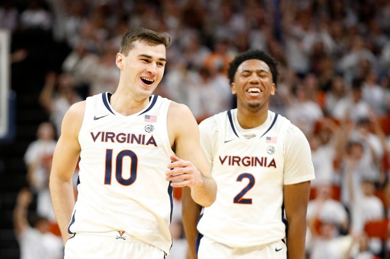 Feb 5, 2024; Charlottesville, Virginia, USA; Virginia Cavaliers guard Taine Murray (10) celebrates after scoring against the Miami (Fl) Hurricanes during the first half at John Paul Jones Arena. Mandatory Credit: Amber Searls-USA TODAY Sports