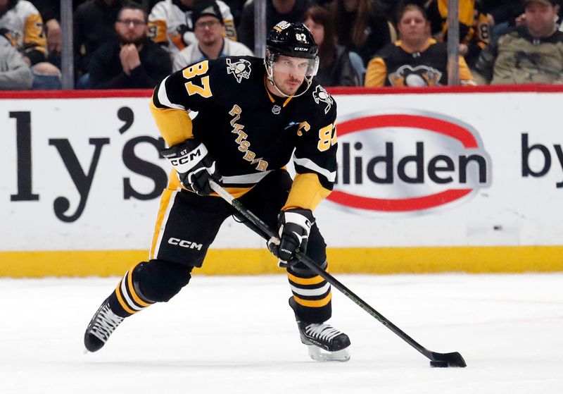 Jan 11, 2024; Pittsburgh, Pennsylvania, USA; Pittsburgh Penguins center Sidney Crosby (87) skates up ice with the puck against the Vancouver Canucks during the first period at PPG Paints Arena. Mandatory Credit: Charles LeClaire-USA TODAY Sports