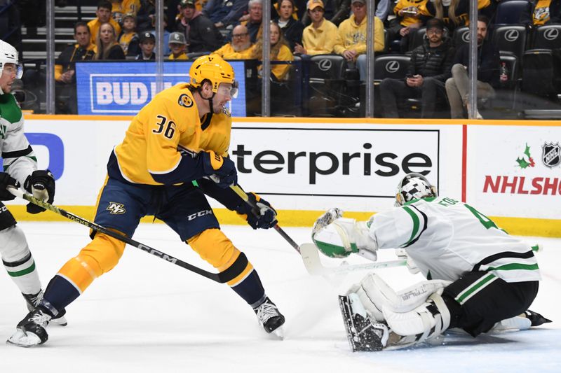 Dec 23, 2023; Nashville, Tennessee, USA; Nashville Predators left wing Cole Smith (36) has a shot blocked by Dallas Stars goaltender Scott Wedgewood (41) during the first period at Bridgestone Arena. Mandatory Credit: Christopher Hanewinckel-USA TODAY Sports