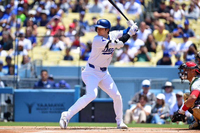 May 19, 2024; Los Angeles, California, USA; Los Angeles Dodgers designated hitter Shohei Ohtani (17) hits against the Cincinnati Reds during the first inning at Dodger Stadium. Mandatory Credit: Gary A. Vasquez-USA TODAY Sports