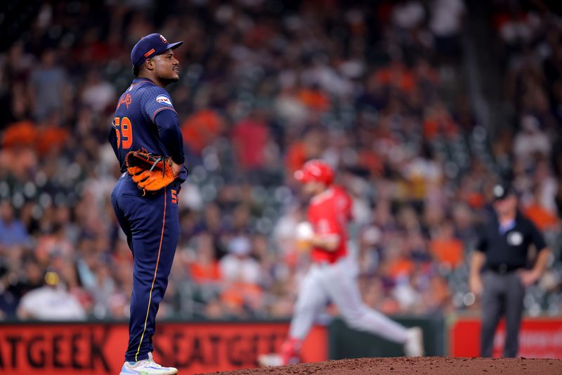 May 20, 2024; Houston, Texas, USA; Houston Astros starting pitcher Framber Valdez (59) reacts after Los Angeles Angels first baseman Nolan Schanuel (18) hit a three-run home run during the fifth inning at Minute Maid Park. Mandatory Credit: Erik Williams-USA TODAY Sports