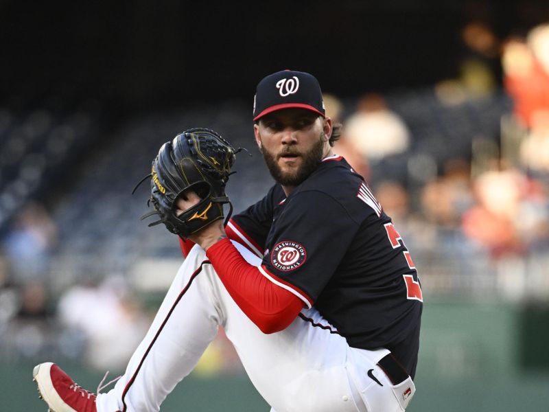 Apr 23, 2025; Washington, District of Columbia, USA; Washington Nationals pitcher Trevor Williams (32) throws to the Baltimore Orioles during the first inning at Nationals Park. Mandatory Credit: Brad Mills-Imagn Images