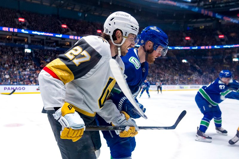 Apr 8, 2024; Vancouver, British Columbia, CAN; Vancouver Canucks forward Sam Lafferty (18) battles with Vegas Golden Knights defenseman Shea Theodore (27) in the first period at Rogers Arena. Mandatory Credit: Bob Frid-USA TODAY Sports