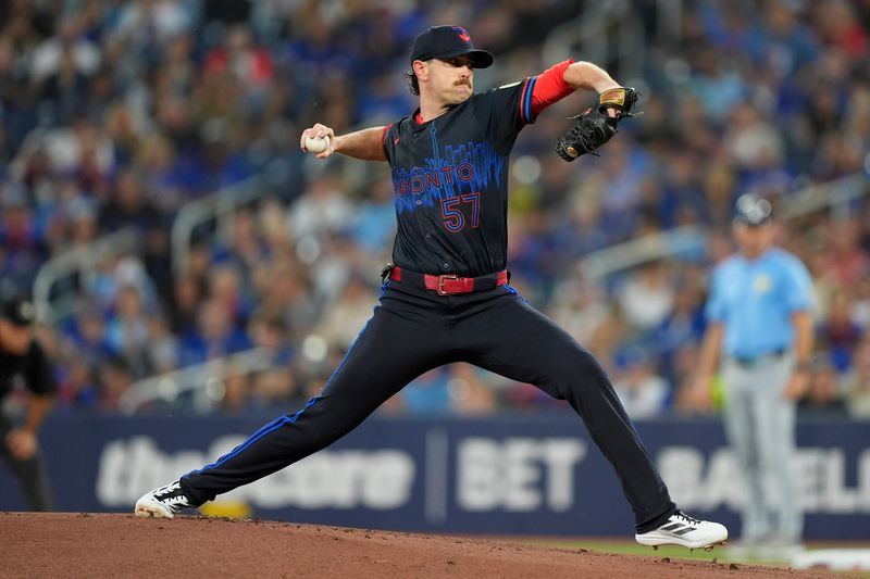 Sep 26, 2025; Toronto, Ontario, CAN; Toronto Blue Jays starting pitcher Shane Bieber (57) pitches to the Tampa Bay Rays during the first inning at Rogers Centre. Mandatory Credit: John E. Sokolowski-Imagn Images