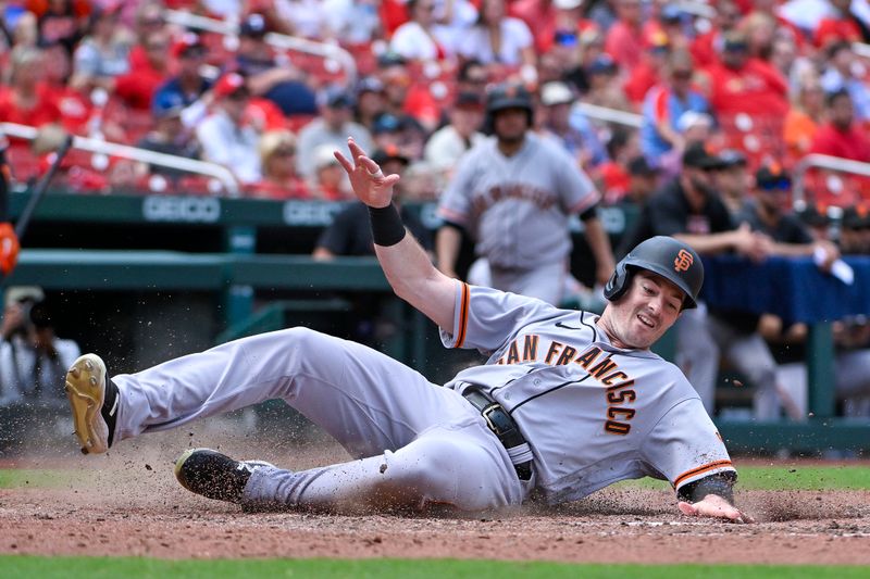 Jun 14, 2023; St. Louis, Missouri, USA;  San Francisco Giants center fielder Mike Yastrzemski (5) slides safely in at home against the St. Louis Cardinals during the tenth inning at Busch Stadium. Mandatory Credit: Jeff Curry-USA TODAY Sports