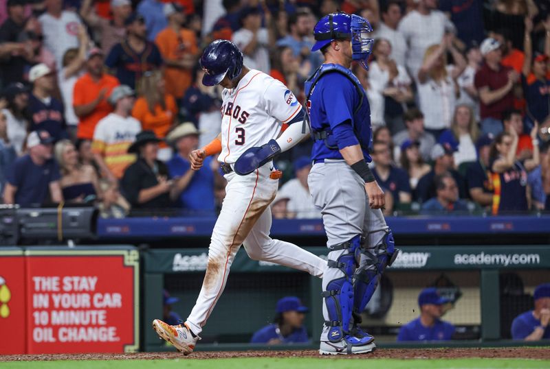 May 17, 2023; Houston, Texas, USA; Houston Astros shortstop Jeremy Pena (3) scores a run past Chicago Cubs catcher Yan Gomes (15) during the eighth inning at Minute Maid Park. Mandatory Credit: Troy Taormina-USA TODAY Sports