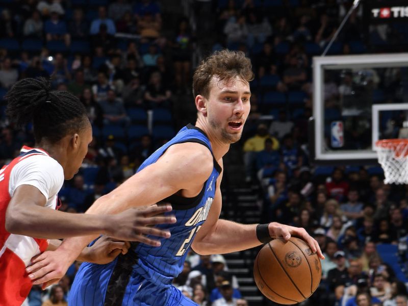 ORLANDO, FL - FEBRUARY 23:  Franz Wagner #22 of the Orlando Magic handles the ball during the game against the Washington Wizards on February 23, 2025 at Kia Center in Orlando, Florida. NOTE TO USER: User expressly acknowledges and agrees that, by downloading and or using this photograph, User is consenting to the terms and conditions of the Getty Images License Agreement. Mandatory Copyright Notice: Copyright 2025 NBAE (Photo by Fernando Medina/NBAE via Getty Images)