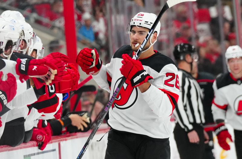 Apr 29, 2025; Raleigh, North Carolina, USA; New Jersey Devils right wing Timo Meier (28) celebrates his goal against the Carolina Hurricanes during the first period in game five of the first round of the 2025 Stanley Cup Playoffs at Lenovo Center. Mandatory Credit: James Guillory-Imagn Images