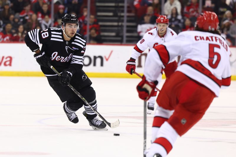 Mar 9, 2024; Newark, New Jersey, USA; New Jersey Devils right wing Timo Meier (28) skates with the puck against the Carolina Hurricanes during the second period at Prudential Center. Mandatory Credit: Ed Mulholland-USA TODAY Sports