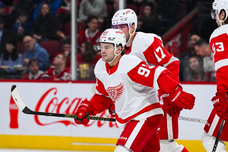 Dec 2, 2023; Montreal, Quebec, CAN; Detroit Red Wings right wing Alex DeBrincat (93) skates back to his bench after celebrating his goal against the Montreal Canadiens during the second period at Bell Centre. Mandatory Credit: David Kirouac-USA TODAY Sports