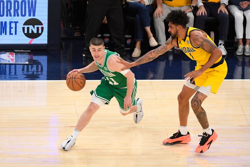 INDIANAPOLIS, IN - MAY 27:  Obi Toppin #1 of the Indiana Pacers plays defense during the game  against Payton Pritchard #11 of the Boston Celtics during Game 4 of the Eastern Conference Finals of the 2024 NBA Playoffs on May 27, 2024 at Gainbridge Fieldhouse in Indianapolis, Indiana. NOTE TO USER: User expressly acknowledges and agrees that, by downloading and or using this Photograph, user is consenting to the terms and conditions of the Getty Images License Agreement. Mandatory Copyright Notice: Copyright 2024 NBAE (Photo by Brian Babineau/NBAE via Getty Images)