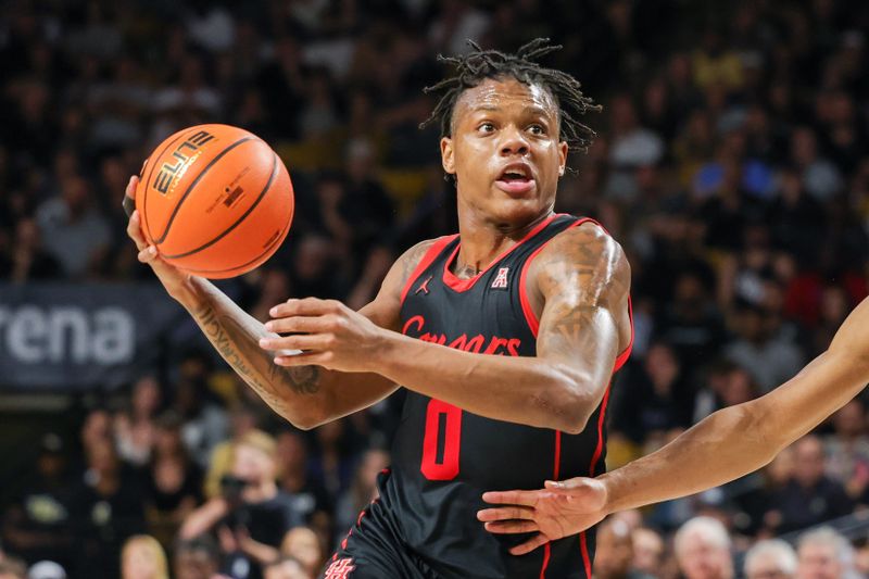 Jan 25, 2023; Orlando, Florida, USA; Houston Cougars guard Marcus Sasser (0) goes to the basket during the second half against the UCF Knights at Addition Financial Arena. Mandatory Credit: Mike Watters-USA TODAY Sports